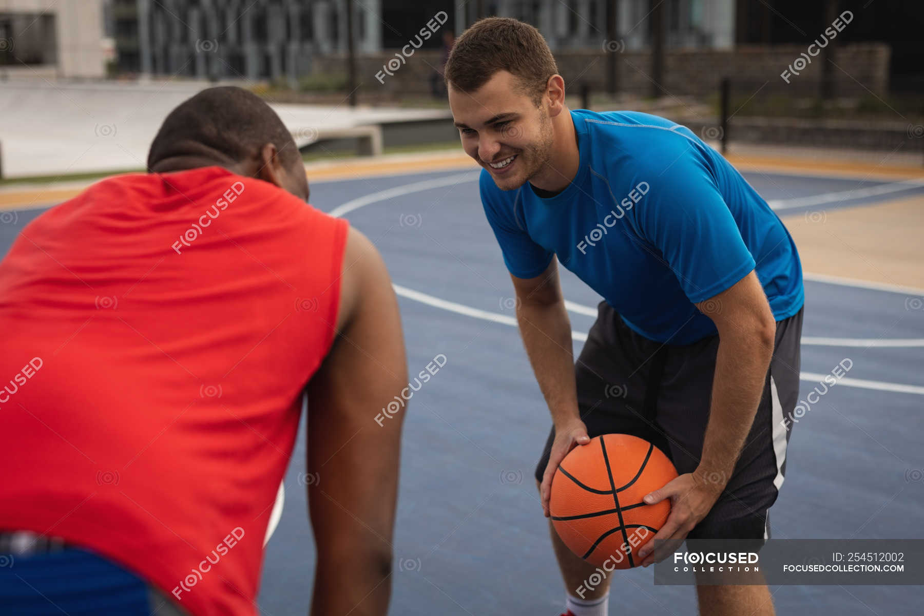 side-view-of-multi-ethnic-basketball-players-interacting-with-each