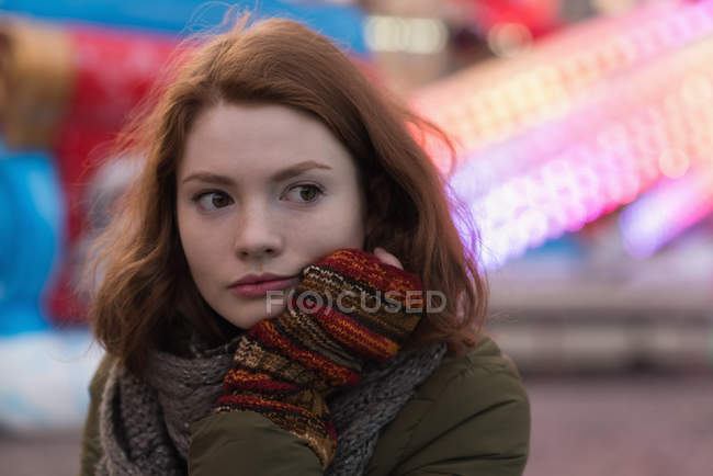 Thoughtful woman in winter clothing — Stock Photo