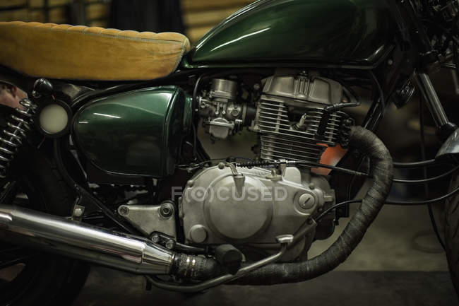 Close-up of motorbike at garage — Stock Photo