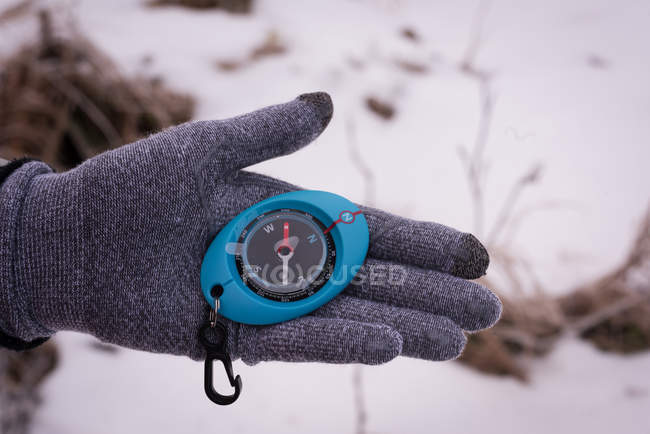 Close-up of woman hand holding compass — Stock Photo