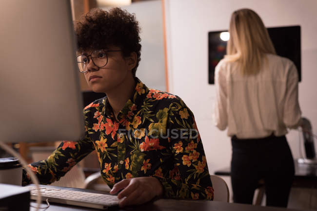 Female executive working at desk in office — Stock Photo