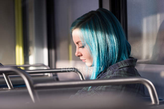 Thoughtful stylish woman travelling in train — Stock Photo