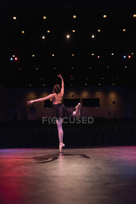 Ballet dancer dancing on stage at theatre — Stock Photo