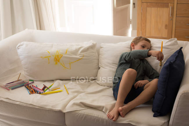 Boy playing in living room at home — Stock Photo