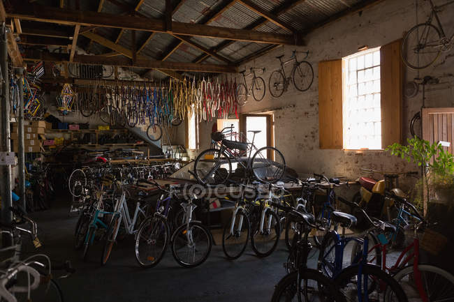 Various bicycles in workshop — Stock Photo