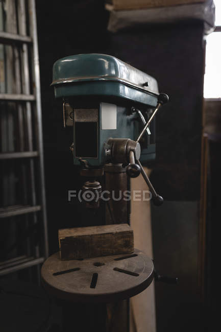 Close up of drill press machine in workshop — Stock Photo