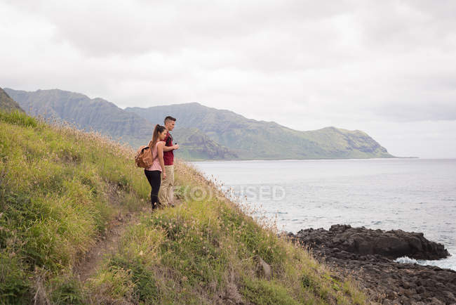 Romantic couple standing together in countryside — Stock Photo