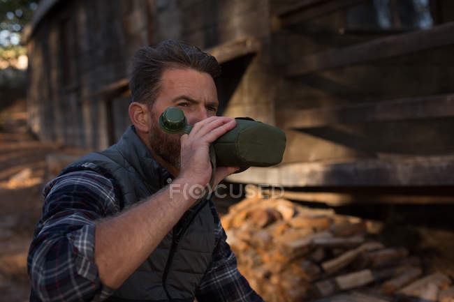 Man drinking water from bottle on a sunny day — Stock Photo