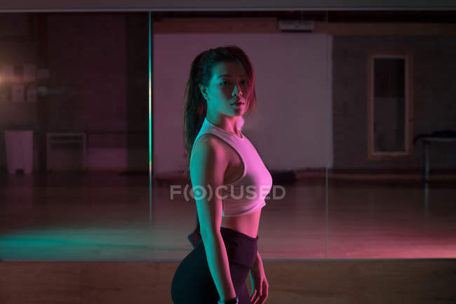 Portrait of female dancer standing in dance studio — Stock Photo