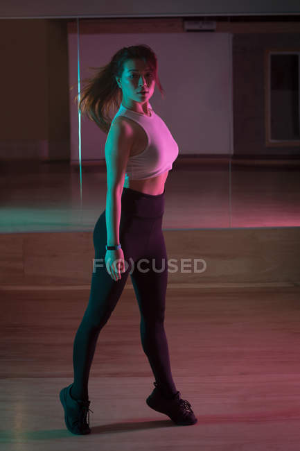 Portrait of female dancer standing in dance studio — Stock Photo