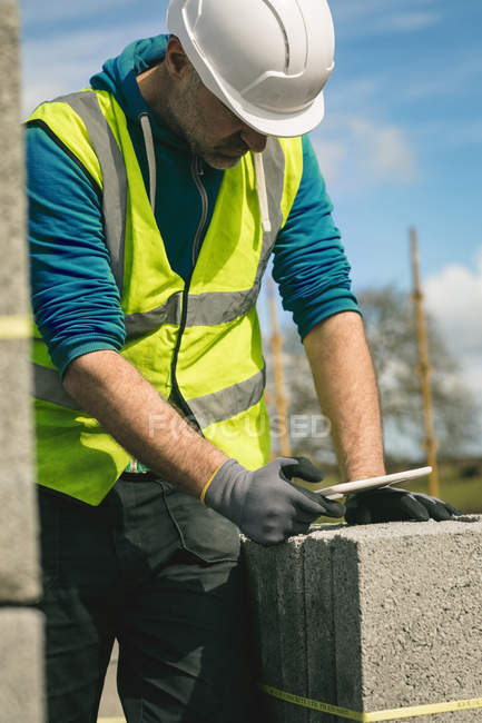 Close-up of engineer using digital tablet at the construction site — Stock Photo