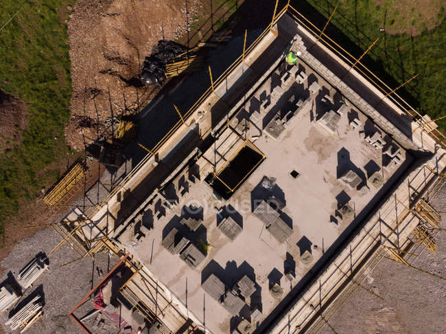 Aerial of a building under construction at the construction site — Stock Photo