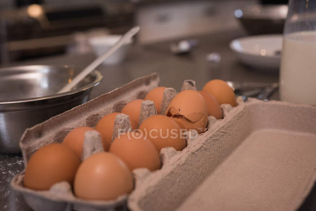 Close-up of egg tray in kitchen at home — Stock Photo