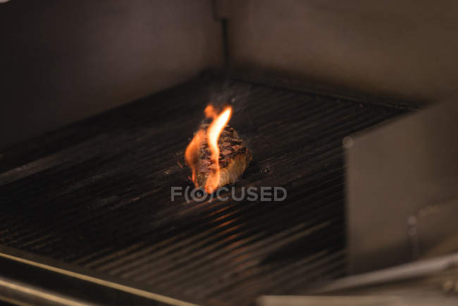 Meat cooking in barbecue at restaurant — Stock Photo