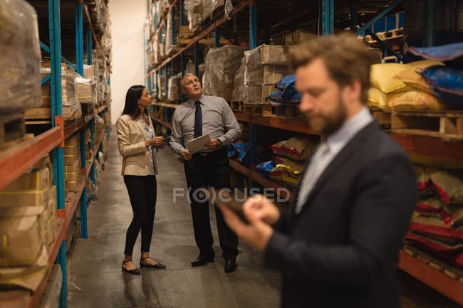 Attentive Staff checking stocks in warehouse — Stock Photo