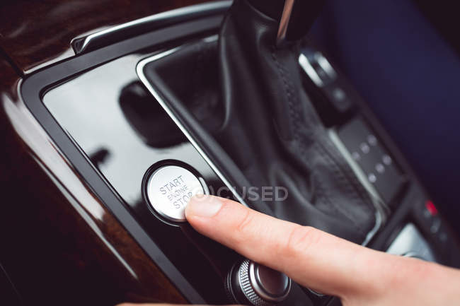 Close-up of male executive using starter of car — Stock Photo