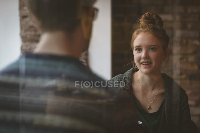 Romantic couple talking to each other in the cafe — Stock Photo