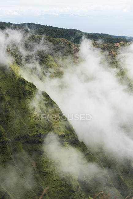 Aerial of clouds hovering over Na Pali Coast State Park — Stock Photo