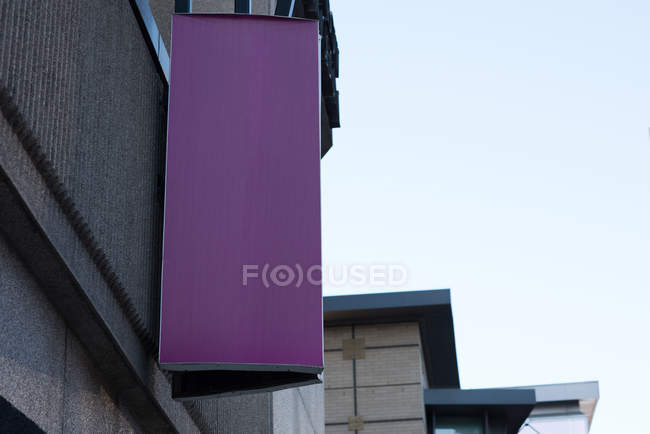 Low angle view of blank advertisement board near street on a sunny day — Stock Photo