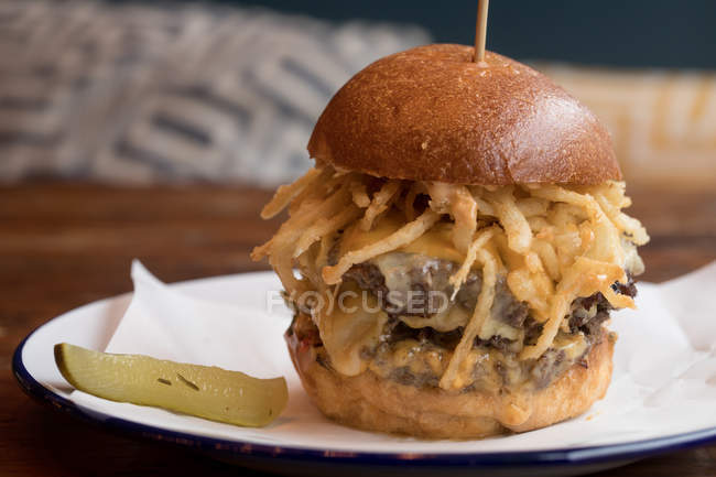 Close-up of burger served in plate at restaurant. — Stock Photo