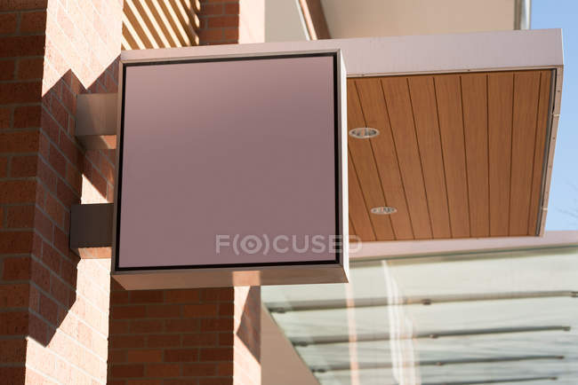 Low angle blank advertisement board near street on a sunny day — Stock Photo