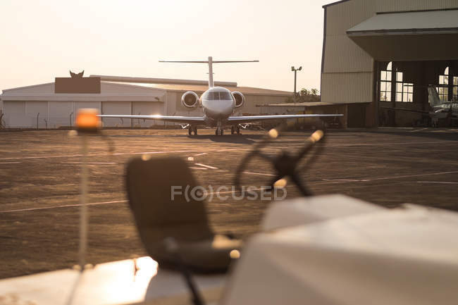 Private jet on runaway at dusk — Stock Photo
