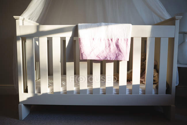 Empty wooden cradle at home — Stock Photo