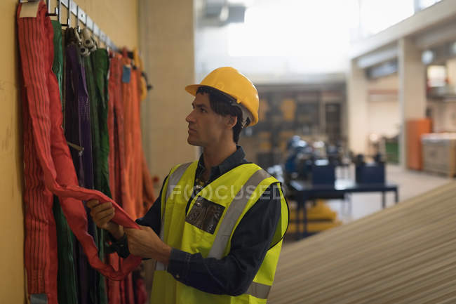 Young male worker working at solar station — Stock Photo