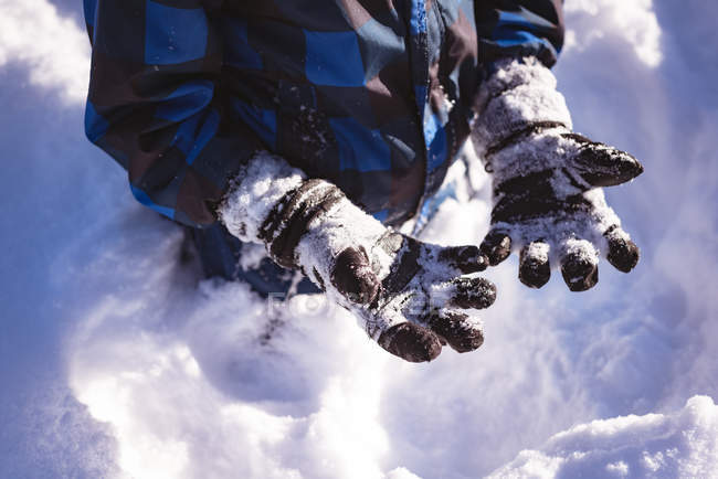 Mid section of boy playing in snow during winter — Stock Photo