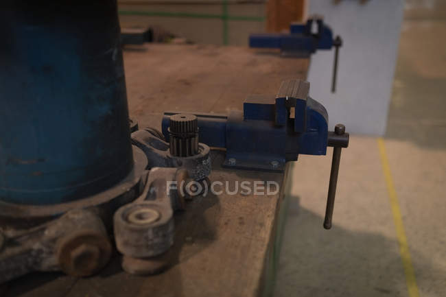 Vise tool on a wooden table at solar station — Stock Photo