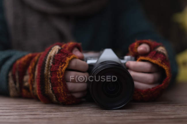 Close-up of woman reviewing photo on camera — Stock Photo
