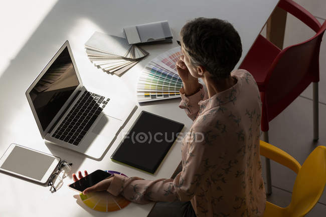 Thoughtful graphic designer working in the office — Stock Photo