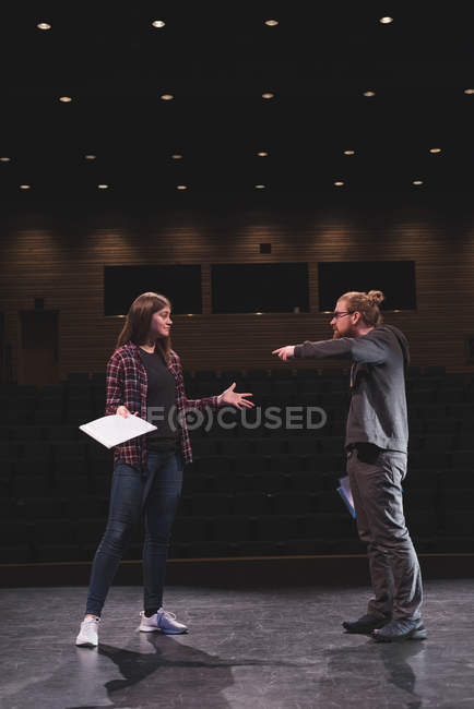 Male actor and female actress performing play on stage at theatre. — Stock Photo