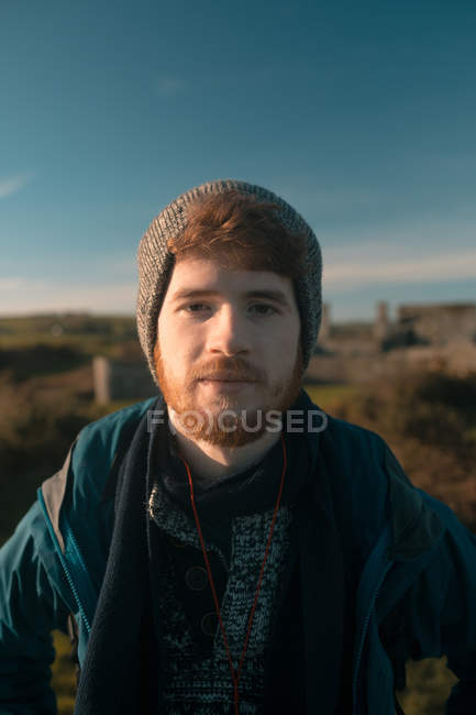Portrait of male hiker standing at countryside — Stock Photo