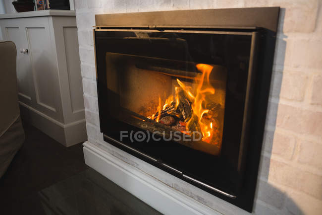 Burning fireplace at home — Stock Photo