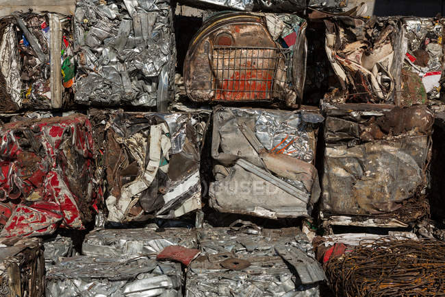 Bundles of compressed trash in scrapyard — Stock Photo