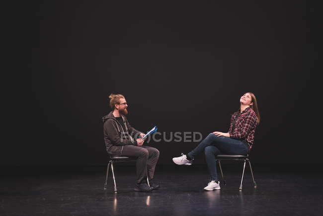 Male and female actress performing play on stage at theatre. — Stock Photo