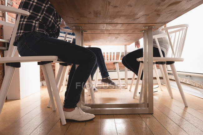 Low section of executives sitting on chair in the creative office — Stock Photo