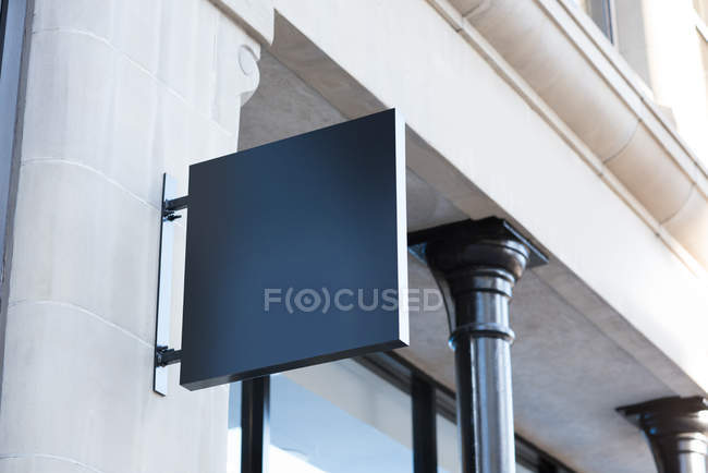 Low angle view of blank advertisement board near street on a sunny day — Stock Photo