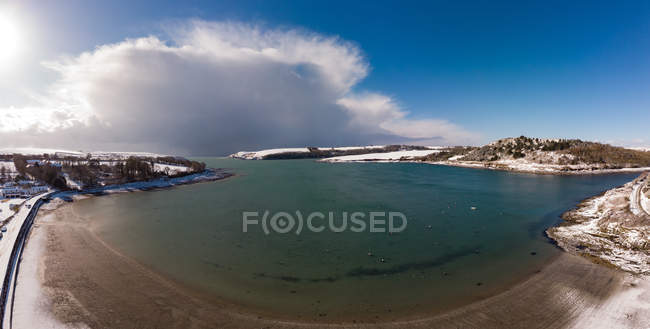Aerial view of river in snowy landscape of County Cork countryside, Ireland — Stock Photo