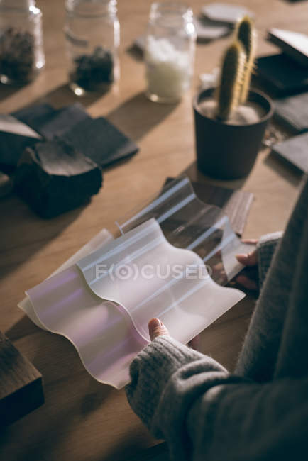 Mid section of executive checking a sample of tile in office — Stock Photo