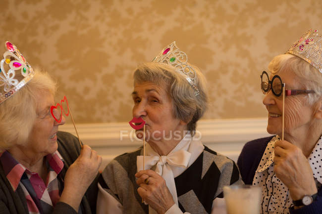 Senior friends having fun together at home — Stock Photo