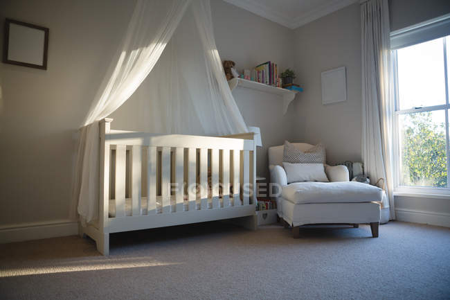 Empty wooden cradle at home — Stock Photo