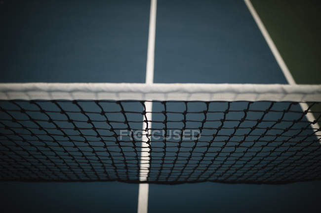 Close-up of net in tennis court at dawn — Stock Photo