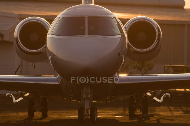 Private jet at terminal in soft light — Stock Photo