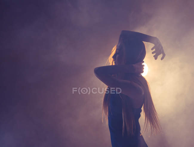 Close-up of young woman dancing in the studio — Stock Photo