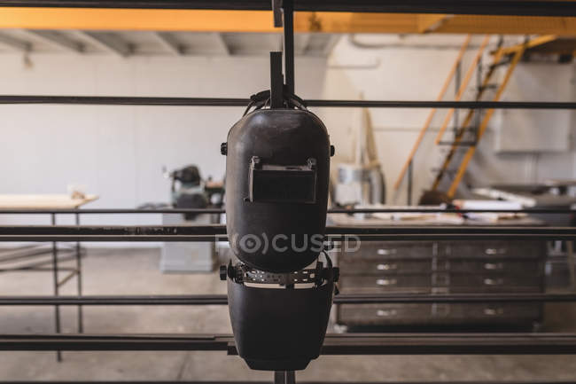 Close-up of welding hanging helmets in workshop. — Stock Photo