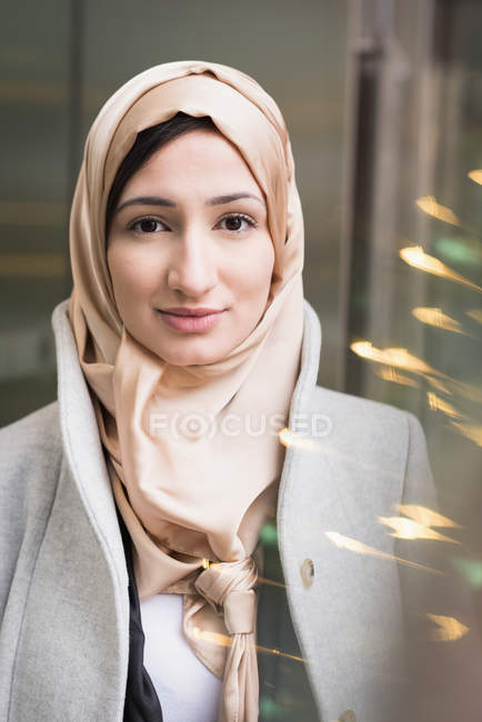 Portrait of happy young woman in hijab — Stock Photo