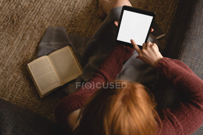 Woman using digital tablet at home — Stock Photo