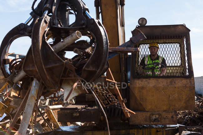 Close-up of crane lifting scrap metal in the junkyard — Stock Photo
